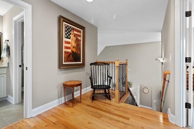 6288 Blacksmith Dr, Pleasant View, TN 37146 - sitting room with an upstairs landing, light wood-style floors, baseboards, and lofted ceiling