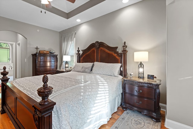 6288 Blacksmith Dr, Pleasant View, TN 37146 - bedroom with multiple windows, light wood finished floors, arched walkways, recessed lighting, and ceiling fan