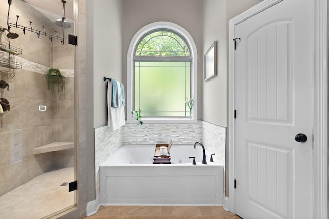 6288 Blacksmith Dr, Pleasant View, TN 37146 - full bathroom featuring a shower stall, a garden tub, and tile patterned flooring