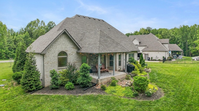 6288 Blacksmith Dr, Pleasant View, TN 37146 - rear view of property with brick siding, a patio area, and roof with shingles