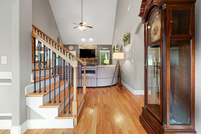 6288 Blacksmith Dr, Pleasant View, TN 37146 - entryway featuring a ceiling fan, high vaulted ceiling, light wood-style flooring, stairs, and baseboards