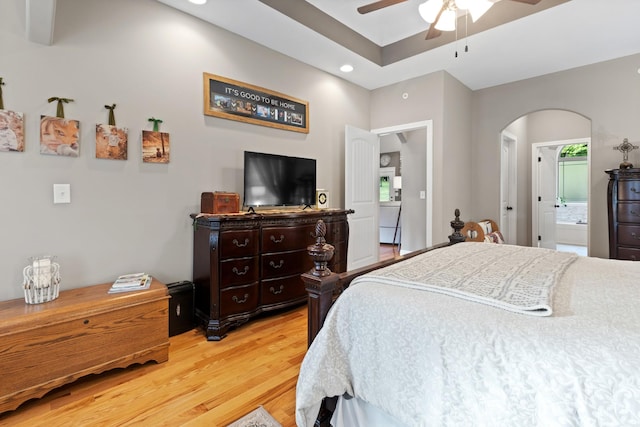 6288 Blacksmith Dr, Pleasant View, TN 37146 - bedroom with light wood finished floors, arched walkways, recessed lighting, ceiling fan, and connected bathroom