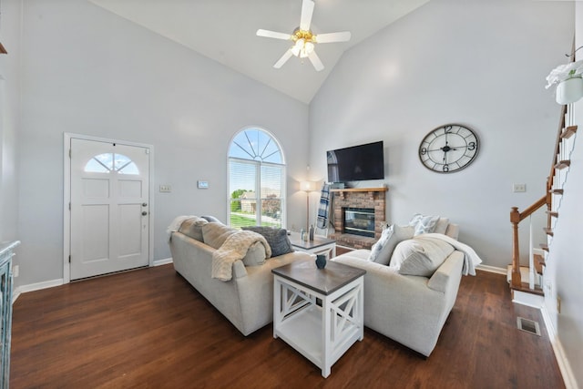 530 David Ave, Lewisburg, TN 37091 - living area featuring high vaulted ceiling, stairs, a glass covered fireplace, dark wood finished floors, and baseboards