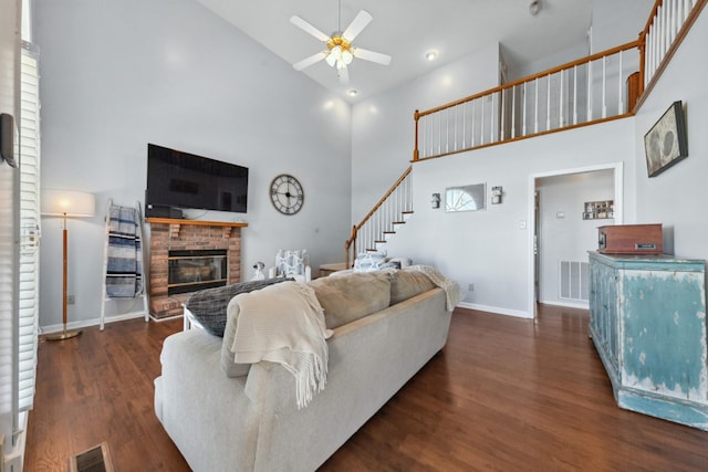 530 David Ave, Lewisburg, TN 37091 - living room with high vaulted ceiling, ceiling fan, baseboards, dark wood finished floors, and a brick fireplace