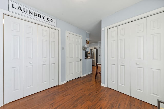 530 David Ave, Lewisburg, TN 37091 - bedroom with stainless steel refrigerator with ice dispenser, dark wood-type flooring, multiple closets, and baseboards