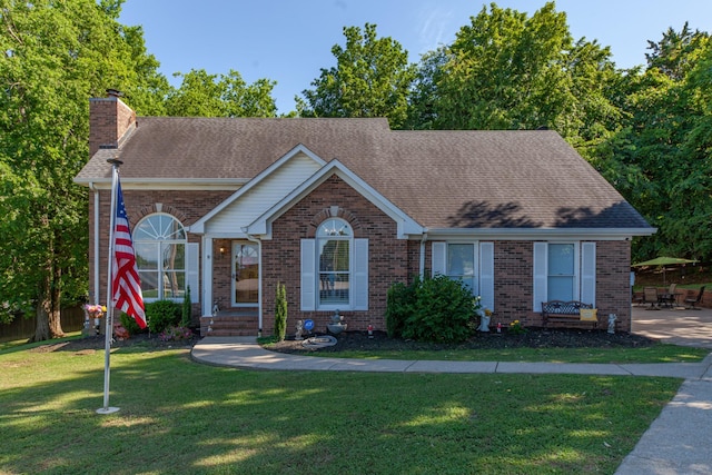 530 David Ave, Lewisburg, TN 37091 - view of front of home with brick siding, a front yard, and a chimney