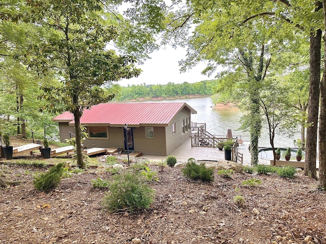 645 Attaway Ln, Bath Springs, TN 38311 - rear view of property featuring metal roof and a deck with water view