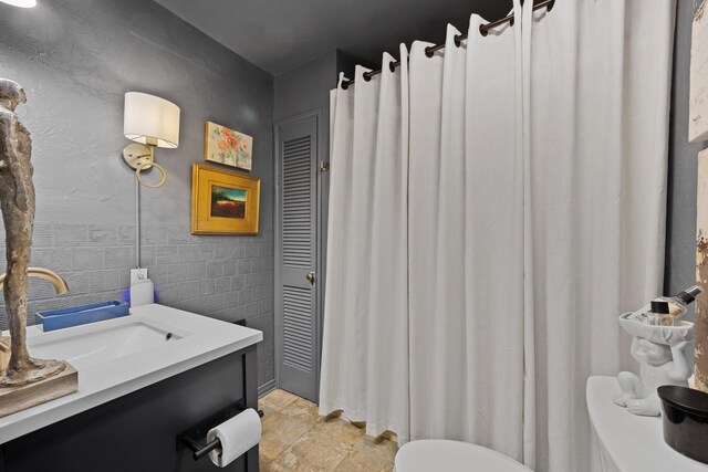 645 Attaway Ln, Bath Springs, TN 38311 - bathroom featuring toilet, vanity, and a closet