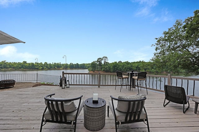 645 Attaway Ln, Bath Springs, TN 38311 - wooden deck featuring an outdoor fire pit and a water view