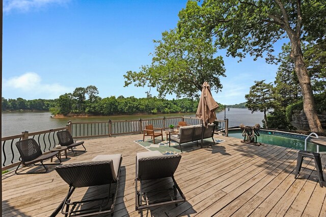 645 Attaway Ln, Bath Springs, TN 38311 - wooden terrace featuring an outdoor hangout area and a water view