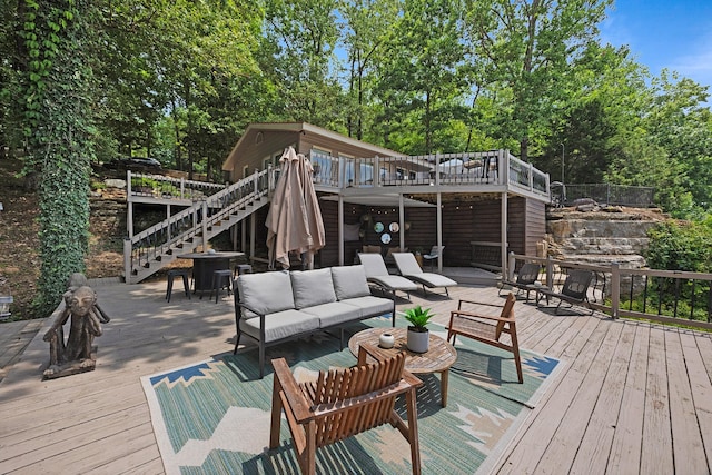 645 Attaway Ln, Bath Springs, TN 38311 - wooden terrace with stairway, an outdoor hangout area, and view of wooded area