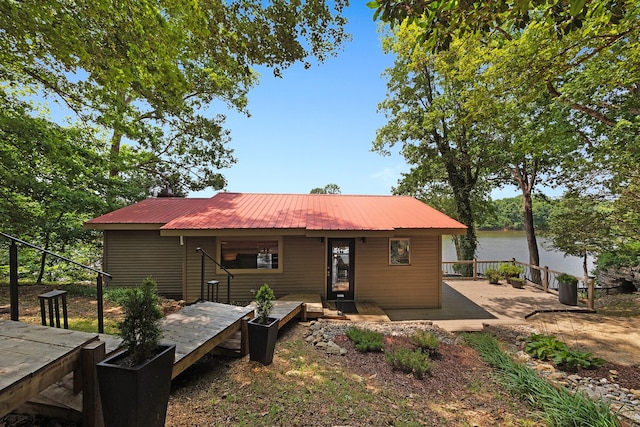 645 Attaway Ln, Bath Springs, TN 38311 - rear view of house with metal roof and a deck with water view