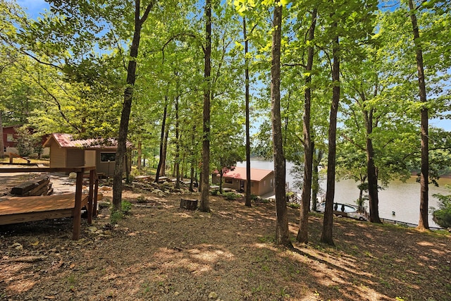 645 Attaway Ln, Bath Springs, TN 38311 - view of yard with a deck with water view and an outbuilding