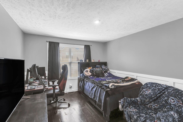 911 Keepsake Diamond Ln, Murfreesboro, TN 37128 - bedroom featuring wood-type flooring, a textured ceiling, an office area, and a wainscoted wall
