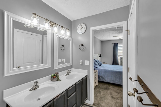 911 Keepsake Diamond Ln, Murfreesboro, TN 37128 - ensuite bathroom with a textured ceiling and double vanity