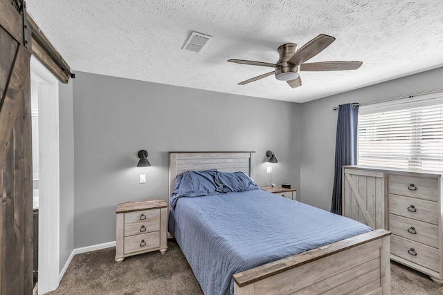 911 Keepsake Diamond Ln, Murfreesboro, TN 37128 - bedroom with dark carpet, a textured ceiling, baseboards, a ceiling fan, and a barn door