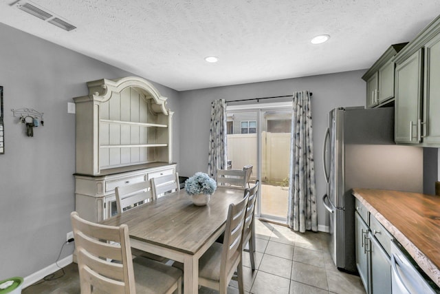 911 Keepsake Diamond Ln, Murfreesboro, TN 37128 - dining space with baseboards, recessed lighting, light tile patterned floors, and a textured ceiling