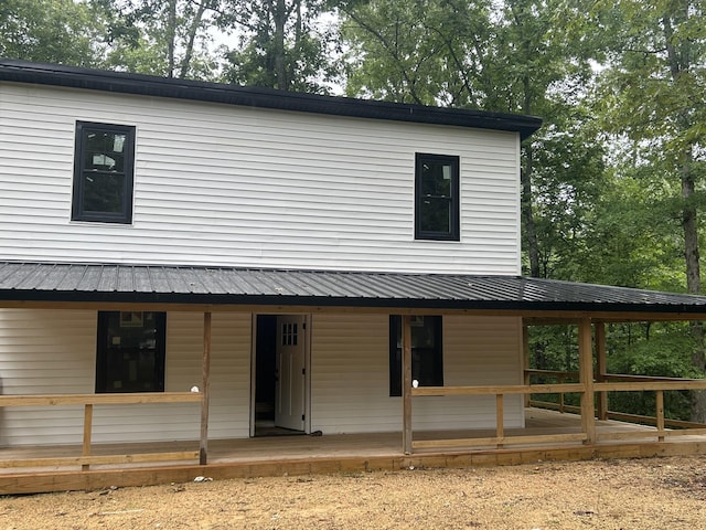 236 Tablerock Rd, Hohenwald, TN 38462 - farmhouse featuring metal roof and covered porch