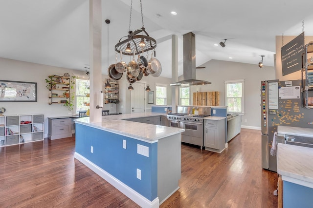 6416 Edsel Dr, Nashville, TN 37209 - kitchen with stainless steel appliances, island range hood, vaulted ceiling, dark wood-style flooring, and light stone countertops