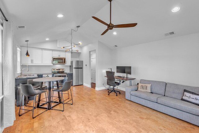 6416 Edsel Dr, Nashville, TN 37209 - living area with ceiling fan, vaulted ceiling, recessed lighting, light wood-type flooring, and a desk