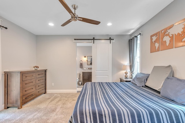 6416 Edsel Dr, Nashville, TN 37209 - bedroom featuring a barn door, recessed lighting, light carpet, baseboards, and connected bathroom