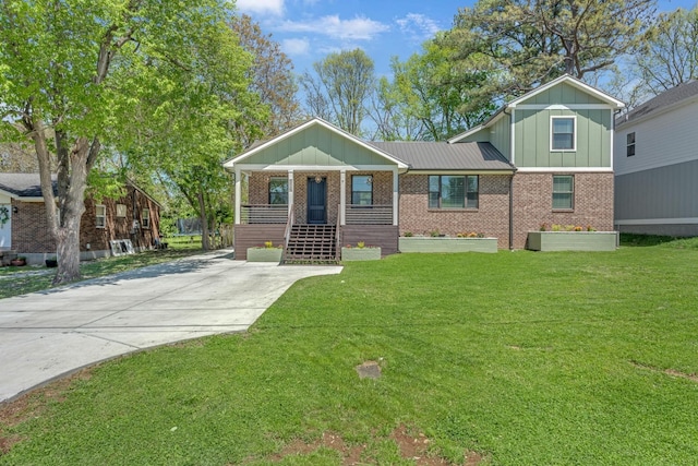 6416 Edsel Dr, Nashville, TN 37209 - view of front facade with board and batten siding, covered porch, brick siding, a front lawn, and concrete driveway