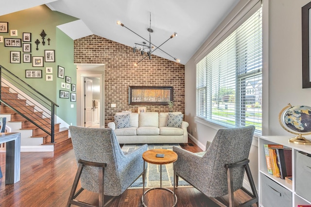 6416 Edsel Dr, Nashville, TN 37209 - living room with lofted ceiling, a chandelier, stairway, dark wood-style floors, and brick wall