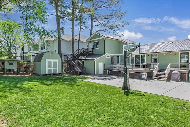 6416 Edsel Dr, Nashville, TN 37209 - rear view of property with stairs, a lawn, board and batten siding, and a wooden deck