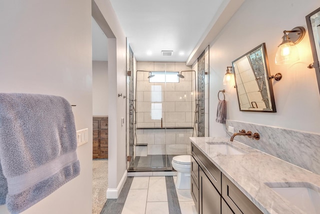6416 Edsel Dr, Nashville, TN 37209 - full bath with toilet, double vanity, a shower stall, and baseboards