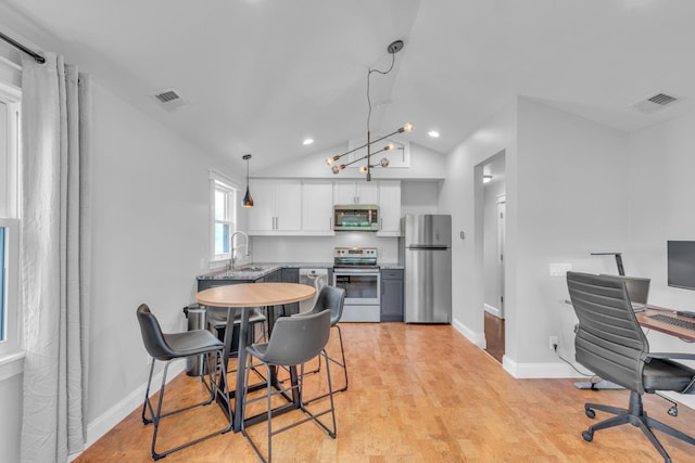 6416 Edsel Dr, Nashville, TN 37209 - dining space with vaulted ceiling, baseboards, light wood-style floors, an office area, and recessed lighting