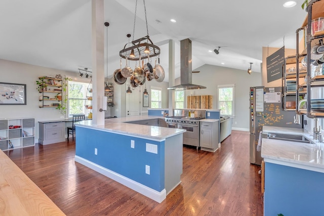 6416 Edsel Dr, Nashville, TN 37209 - kitchen with island exhaust hood, appliances with stainless steel finishes, lofted ceiling, light stone counters, and dark wood-style floors