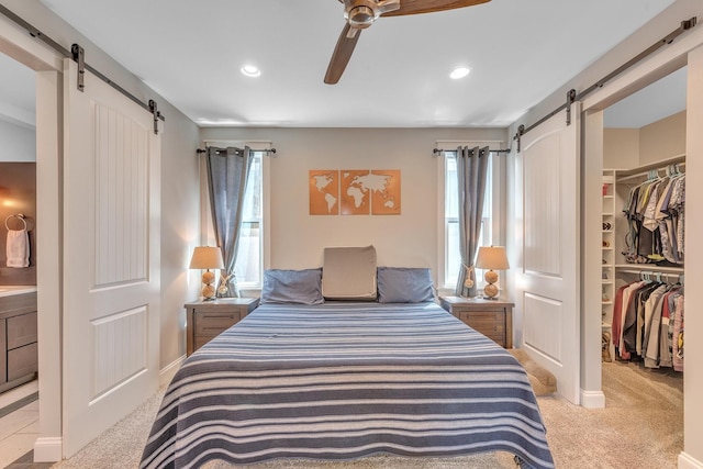 6416 Edsel Dr, Nashville, TN 37209 - bedroom with a barn door, a walk in closet, carpet, and recessed lighting