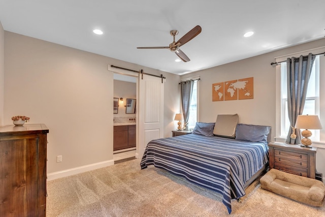 6416 Edsel Dr, Nashville, TN 37209 - bedroom with a barn door, light carpet, recessed lighting, baseboards, and connected bathroom