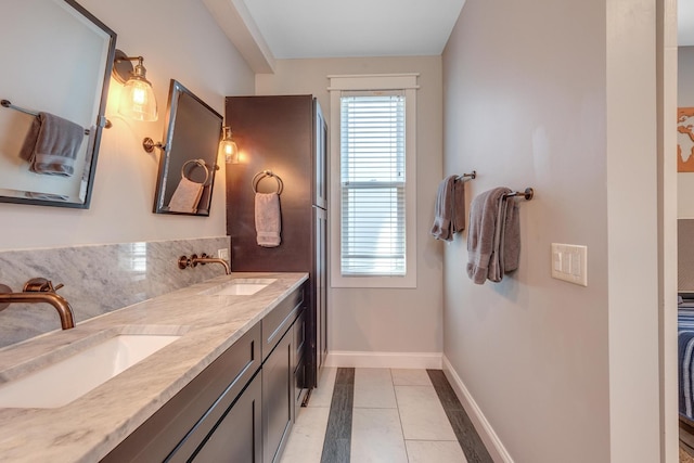 6416 Edsel Dr, Nashville, TN 37209 - bathroom with baseboards, double vanity, and tile patterned flooring