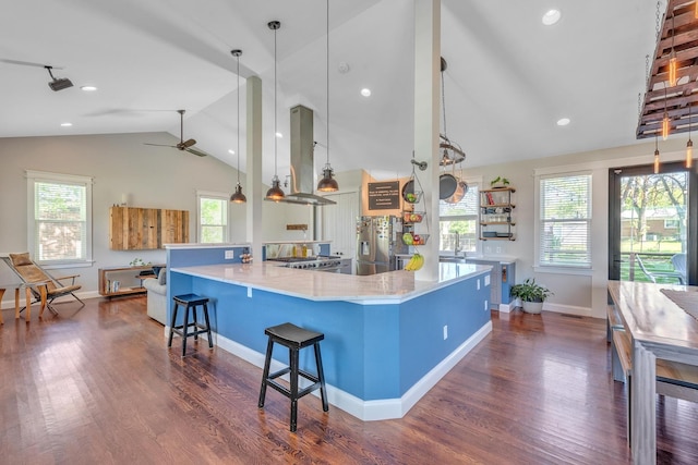 6416 Edsel Dr, Nashville, TN 37209 - kitchen featuring island exhaust hood, lofted ceiling, stainless steel refrigerator with ice dispenser, dark wood-style floors, and baseboards
