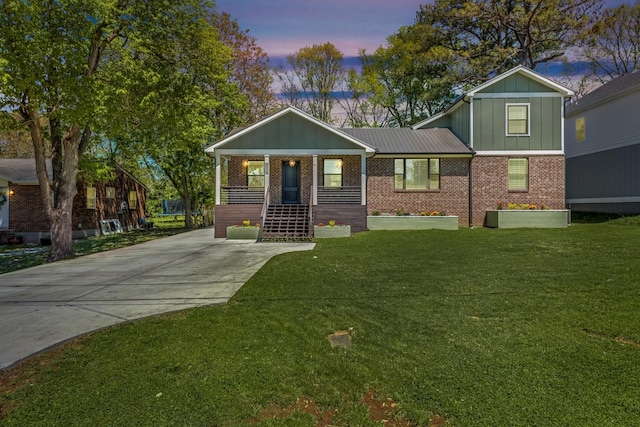 6416 Edsel Dr, Nashville, TN 37209 - view of front of house featuring board and batten siding, a porch, brick siding, a front lawn, and concrete driveway