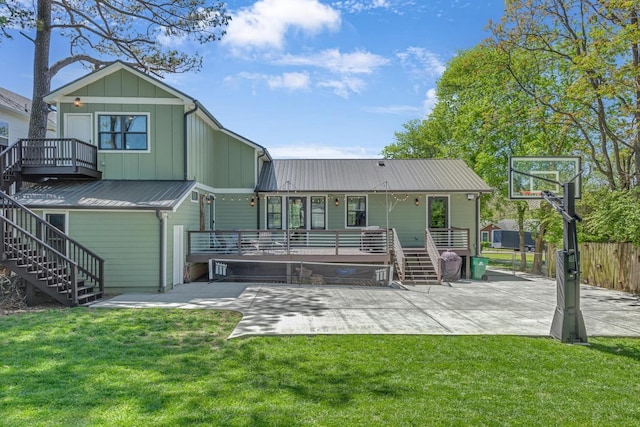 6416 Edsel Dr, Nashville, TN 37209 - back of house featuring stairs, a patio area, board and batten siding, and a wooden deck