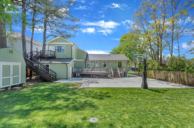 6416 Edsel Dr, Nashville, TN 37209 - rear view of house with stairs, a wooden deck, a patio, and board and batten siding