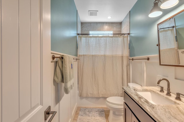 6416 Edsel Dr, Nashville, TN 37209 - full bath with vanity, toilet, wainscoting, and shower / bathtub combination with curtain