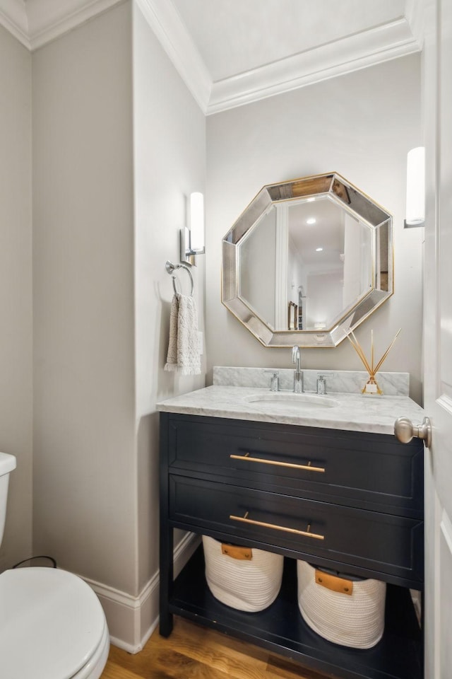 4083 Kings Camp Pass, Arrington, TN 37014 - bathroom featuring toilet, vanity, crown molding, wood finished floors, and baseboards