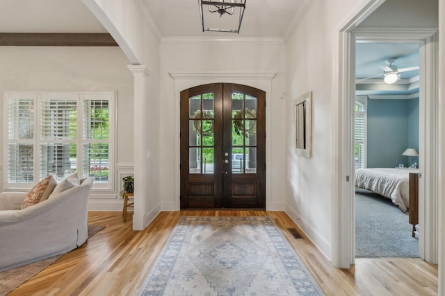 4083 Kings Camp Pass, Arrington, TN 37014 - entryway featuring arched walkways, light wood-type flooring, french doors, and ornamental molding