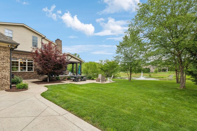 4083 Kings Camp Pass, Arrington, TN 37014 - view of green lawn featuring a patio area