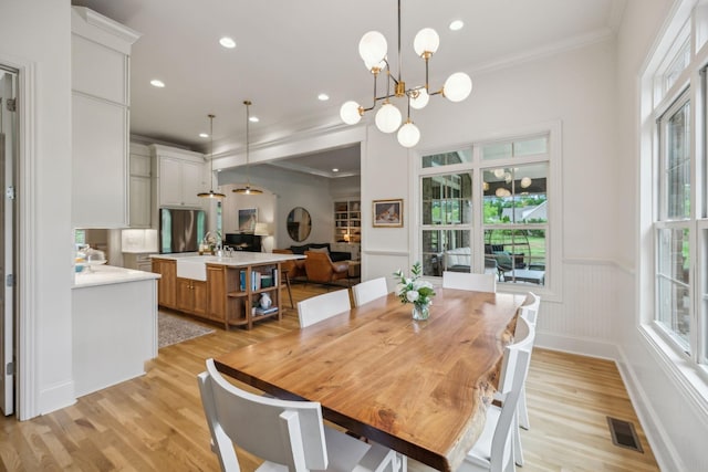 4083 Kings Camp Pass, Arrington, TN 37014 - dining area with plenty of natural light, light wood-type flooring, a wainscoted wall, crown molding, and recessed lighting