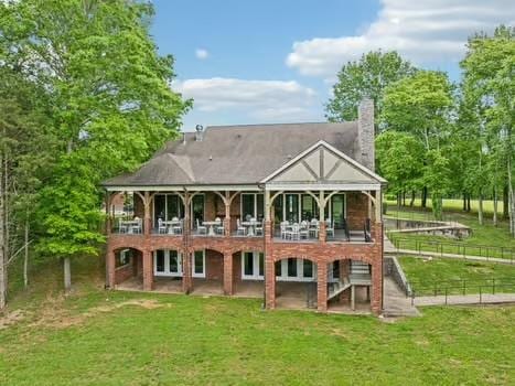 4083 Kings Camp Pass, Arrington, TN 37014 - rear view of house featuring stairs, a chimney, and a deck