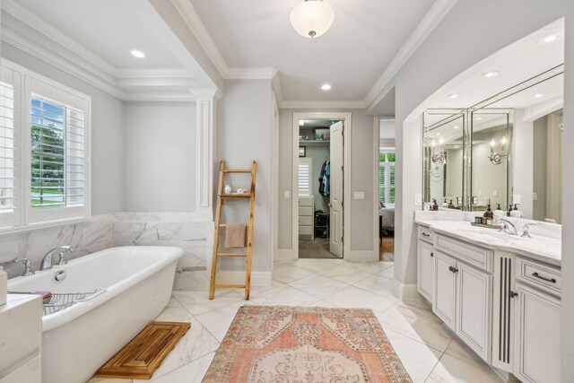 4083 Kings Camp Pass, Arrington, TN 37014 - ensuite bathroom with a soaking tub, vanity, ornamental molding, and recessed lighting