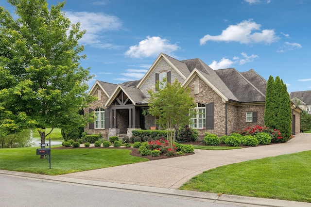 4083 Kings Camp Pass, Arrington, TN 37014 - craftsman-style home with a front lawn, stone siding, brick siding, and roof with shingles