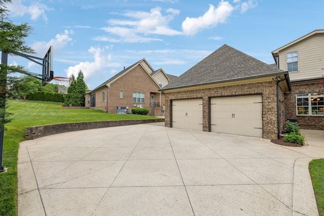 4083 Kings Camp Pass, Arrington, TN 37014 - view of front facade with concrete driveway, a garage, a front lawn, brick siding, and roof with shingles