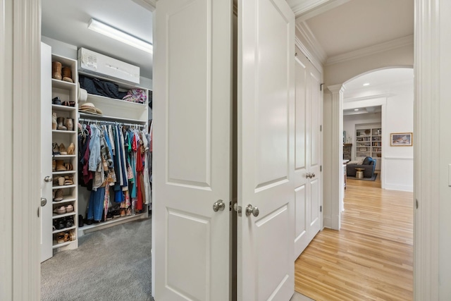 4083 Kings Camp Pass, Arrington, TN 37014 - hall with arched walkways, crown molding, ornate columns, and wood finished floors