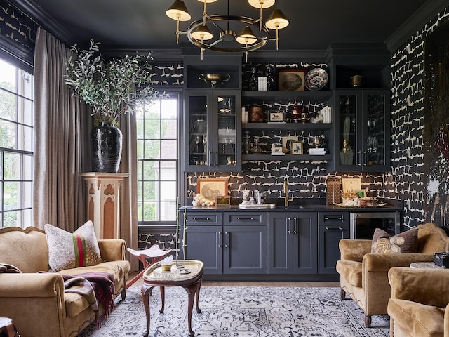 4516 Shys Hill Rd, Nashville, TN 37215 - indoor wet bar with crown molding, beverage cooler, and a chandelier