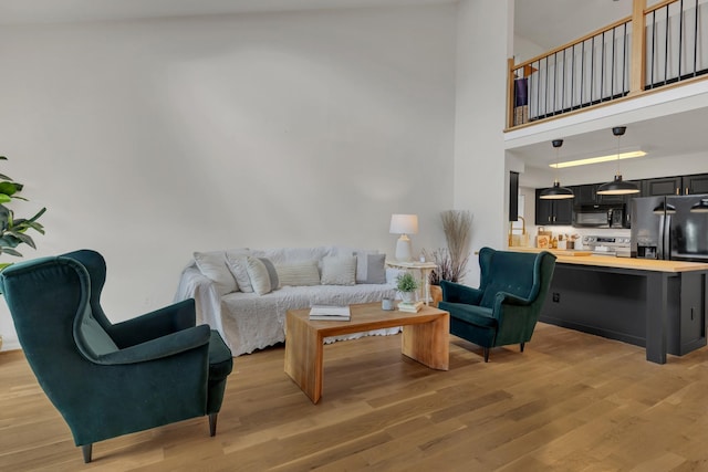235 Glenstone Cir, Brentwood, TN 37027 - living room featuring light wood-style flooring and a towering ceiling
